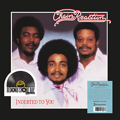 Album cover featuring three men in white shirts with a Record Store Day sticker.