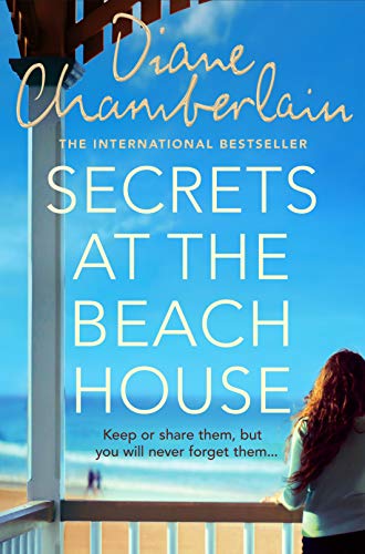 Book cover: "Secrets at the Beach House" with a woman looking at the ocean.