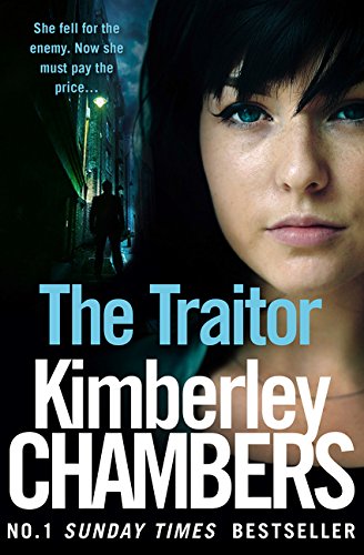 Book cover: woman’s face, shadowy figure, title “The Traitor” in white text.