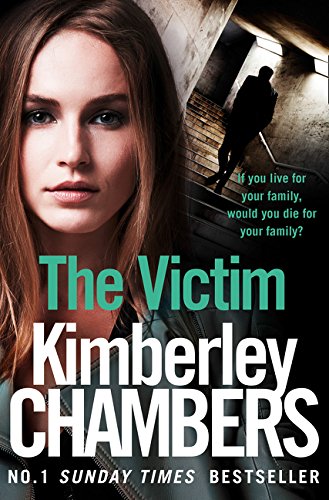 Book cover: woman’s face, shadowy figure on stairs, title “The Victim”.
