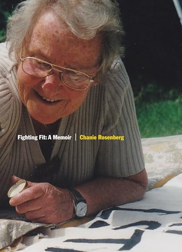 Older woman with glasses smiling, holding a small tin and needle.