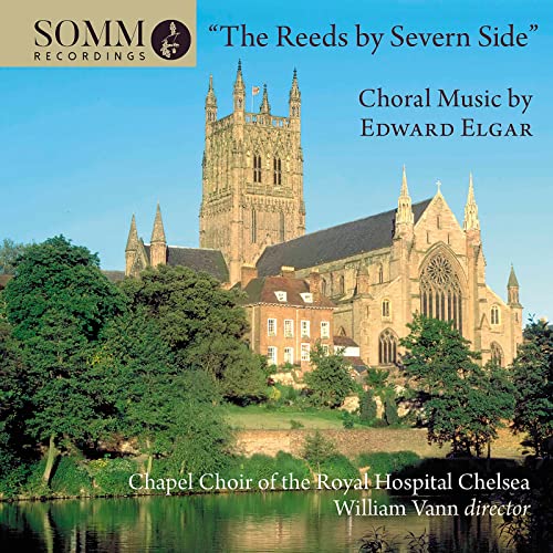 CD cover featuring a large stone cathedral reflected in water.