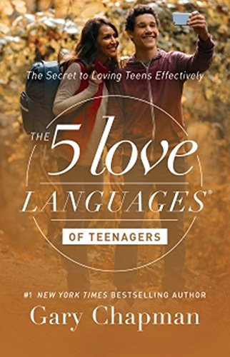 Book cover featuring a woman and teenage boy taking a selfie in autumn woods.