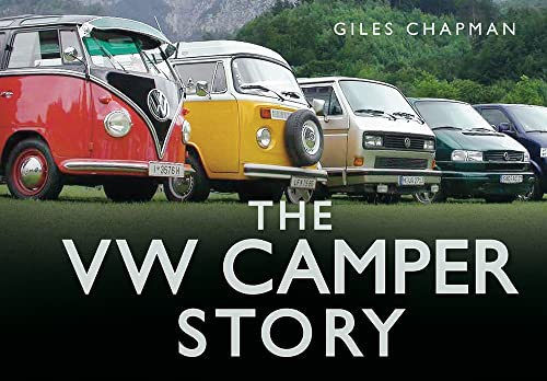 Line of vintage Volkswagen camper vans on green grass.