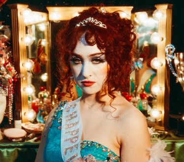 Chappell Roan album cover featuring a woman with red curly hair and a tiara.