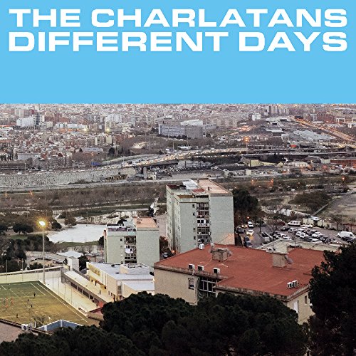 “Different Days” album cover by The Charlatans, featuring a city landscape.