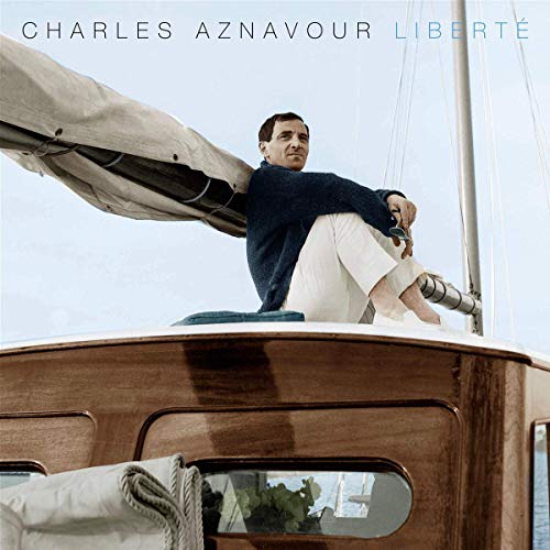 Charles Aznavour album cover: man on a sailboat, blue sky.