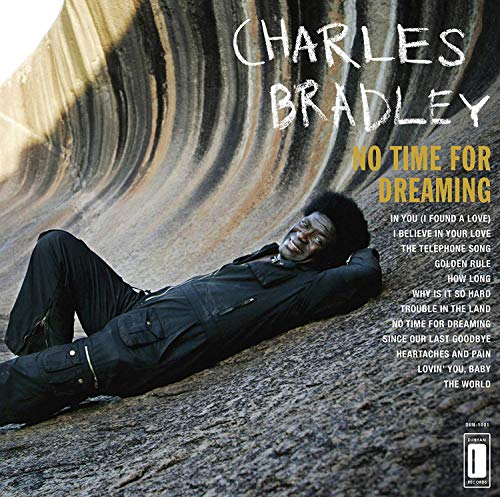 Charles Bradley lying on a curved rock formation with album title and tracklist.