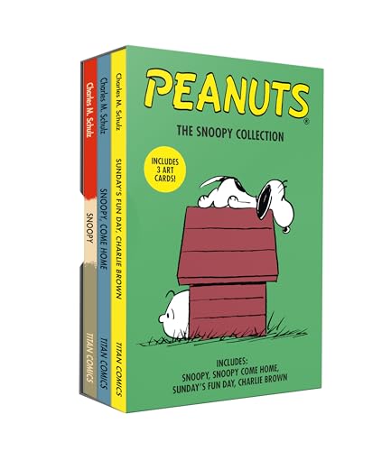 A Peanuts Snoopy boxed set containing three books with Snoopy on his doghouse.