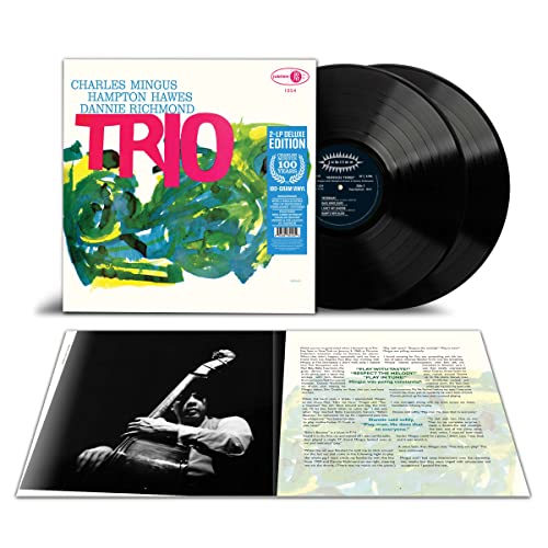 Charles Mingus "Mingus Three" vinyl record with album cover and inner sleeve.