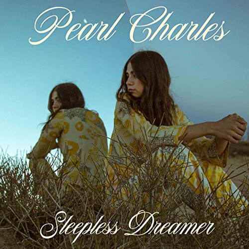 Album cover for Pearl Charles’ “Sleepless Dreamer” featuring a woman in yellow.