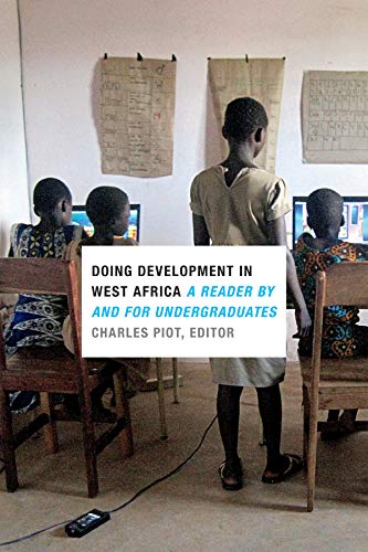 Book cover with students at computers in a West African classroom.