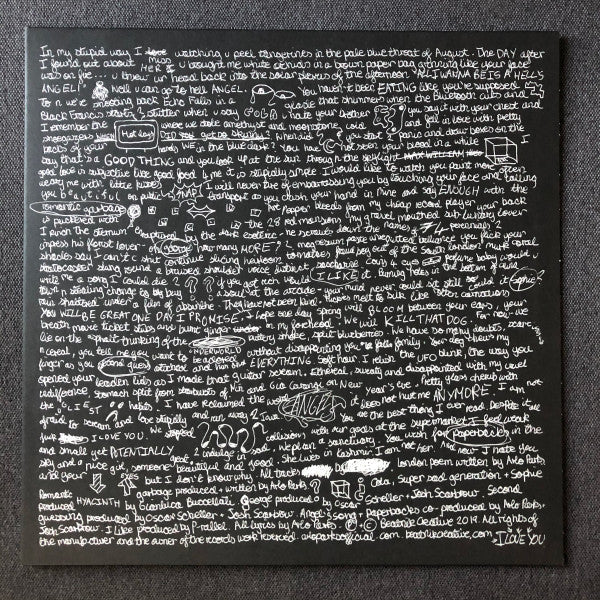 Book cover with handwritten text over a blurred, textured background.