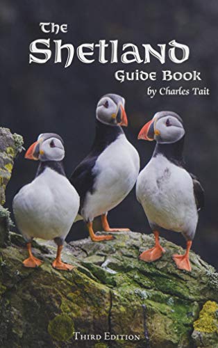 The Shetland Guide Book cover featuring three puffins standing on a rocky cliff.