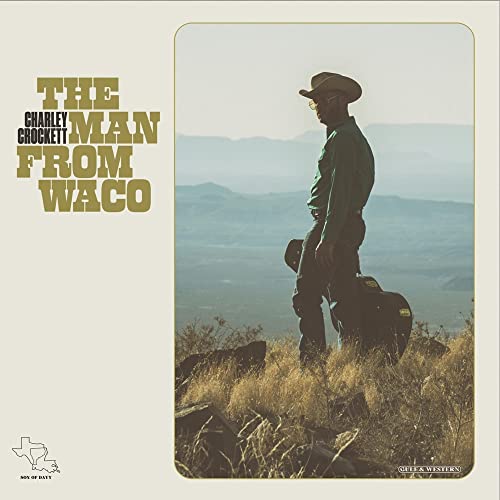 Charley Crockett album cover: man in hat overlooking a hazy landscape.