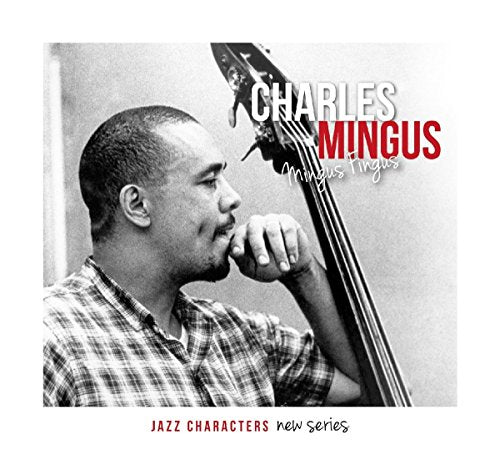 Black and white portrait of Charles Mingus with his double bass.