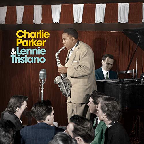 Charlie Parker playing saxophone with Lennie Tristano at a piano, vintage photo.