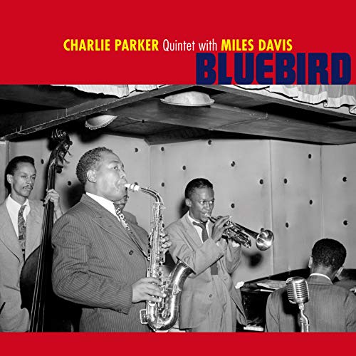 Black and white photo of Charlie Parker and Miles Davis playing jazz instruments.