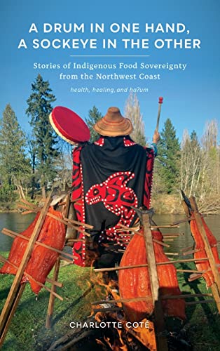 Book cover: person with drum and salmon drying on racks by fire.