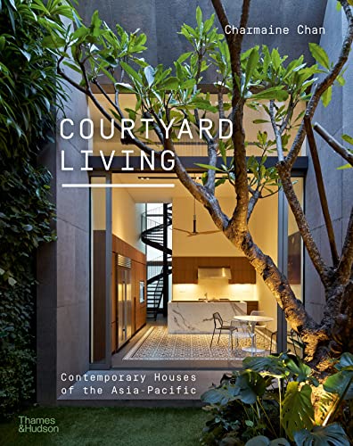 Book cover showing a modern home interior viewed through a courtyard with lush trees.