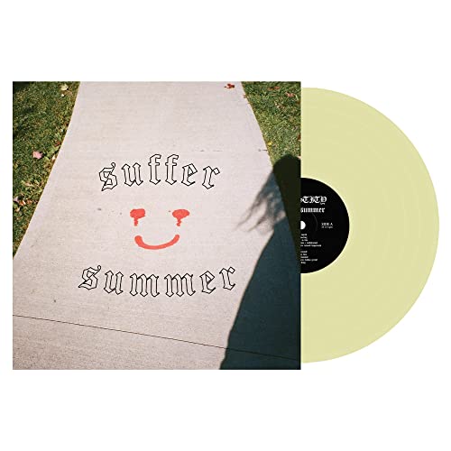Vinyl record with album cover featuring text and a smiling face.
