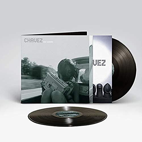 Vinyl record and album cover featuring a person in a car with a boombox.