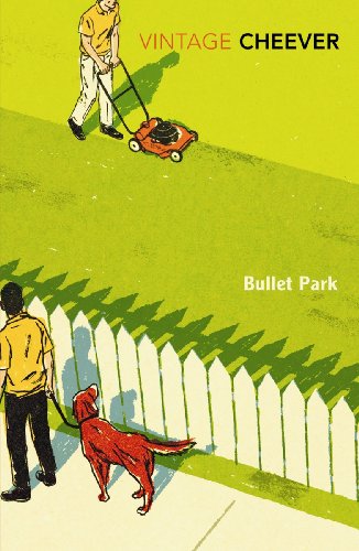 A man mows a lawn while another walks a dog past a white fence.
