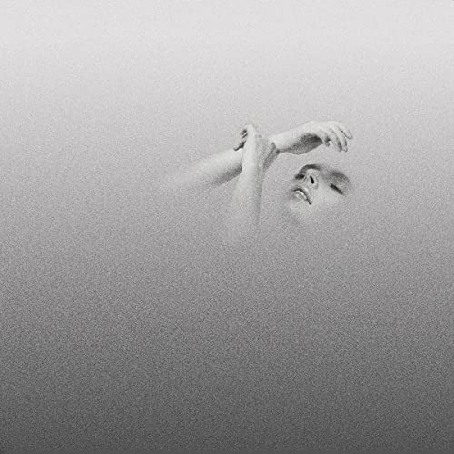 Black and white album cover featuring a person submerged in water.