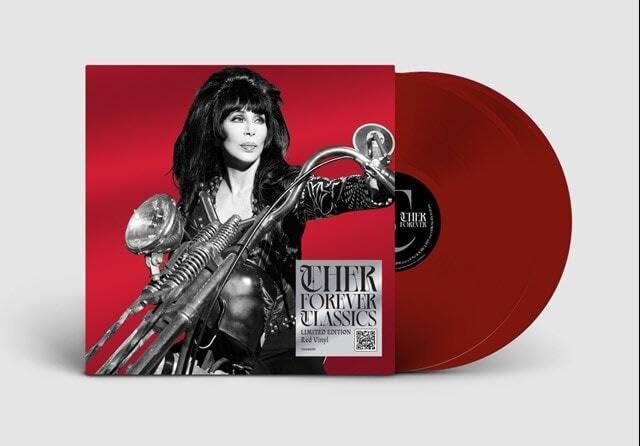 Cher on motorcycle album cover with red vinyl record beside it.