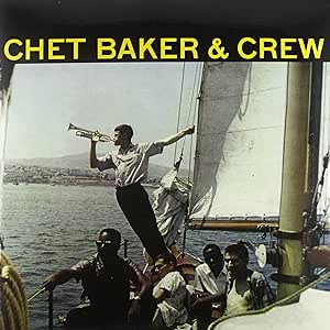 Chet Baker playing trumpet on a boat with a crew, vinyl record cover.