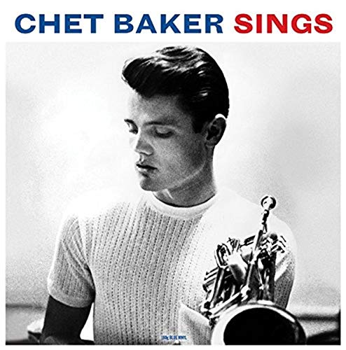 Black and white portrait of Chet Baker with his trumpet.