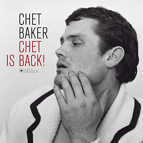 Black and white portrait of jazz musician Chet Baker, hand to chin.