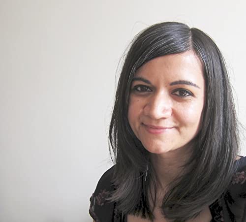 Headshot of a woman with dark hair and a gentle smile.