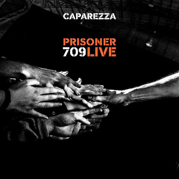 DVD cover for “Prisoner 709 Live” by Caparezza, featuring clasped hands.