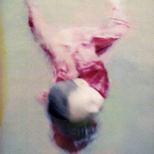 Abstract pink and white image with a small, blurred figure.
