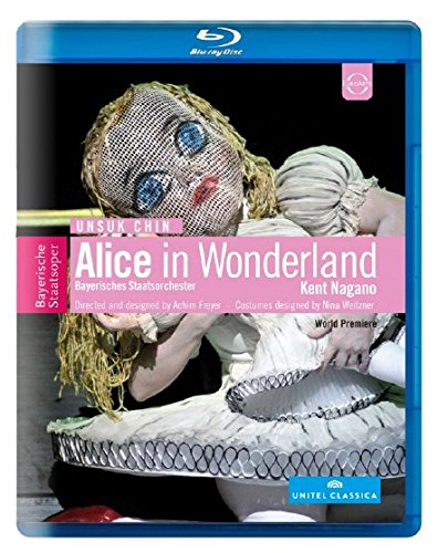 Blu-ray cover featuring a person in an Alice in Wonderland costume with a mesh mask.