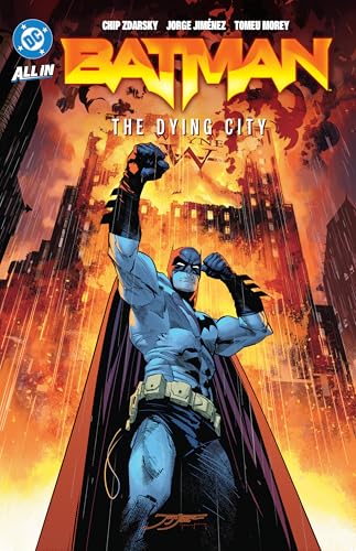 Batman stands defiant before a burning, crumbling cityscape.