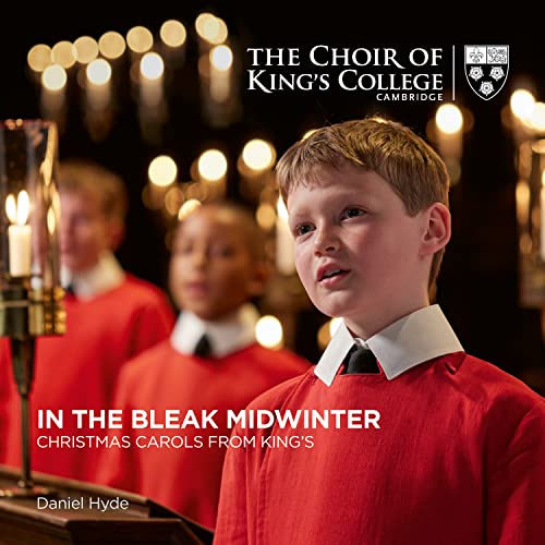 Choirboys in red robes with candles, album cover for Christmas carols.