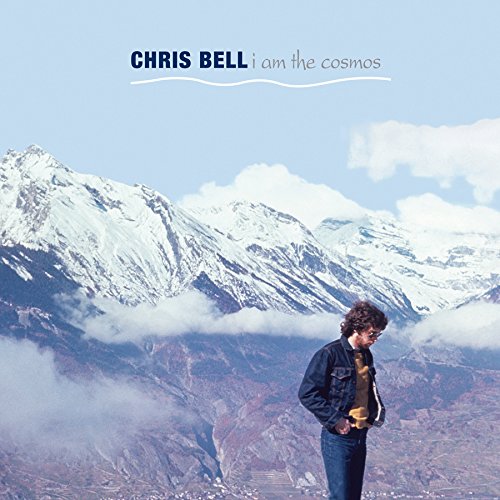 "Album cover with man standing in front of snowy mountains."
