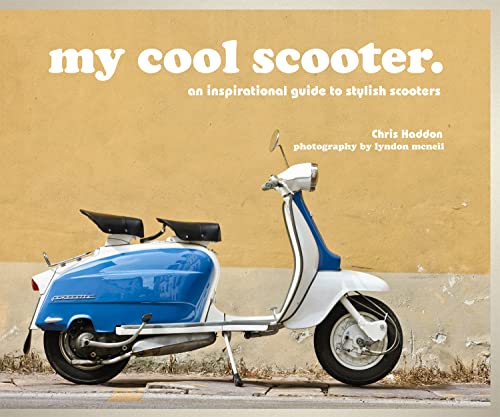 Blue and white vintage scooter on a textured orange background.