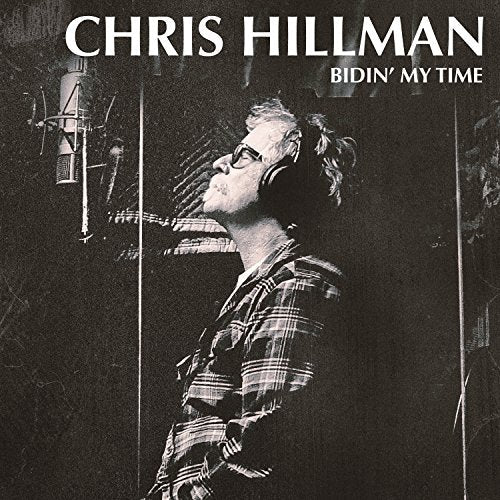 "Black and white vinyl album cover with man wearing headphones in a recording studio."