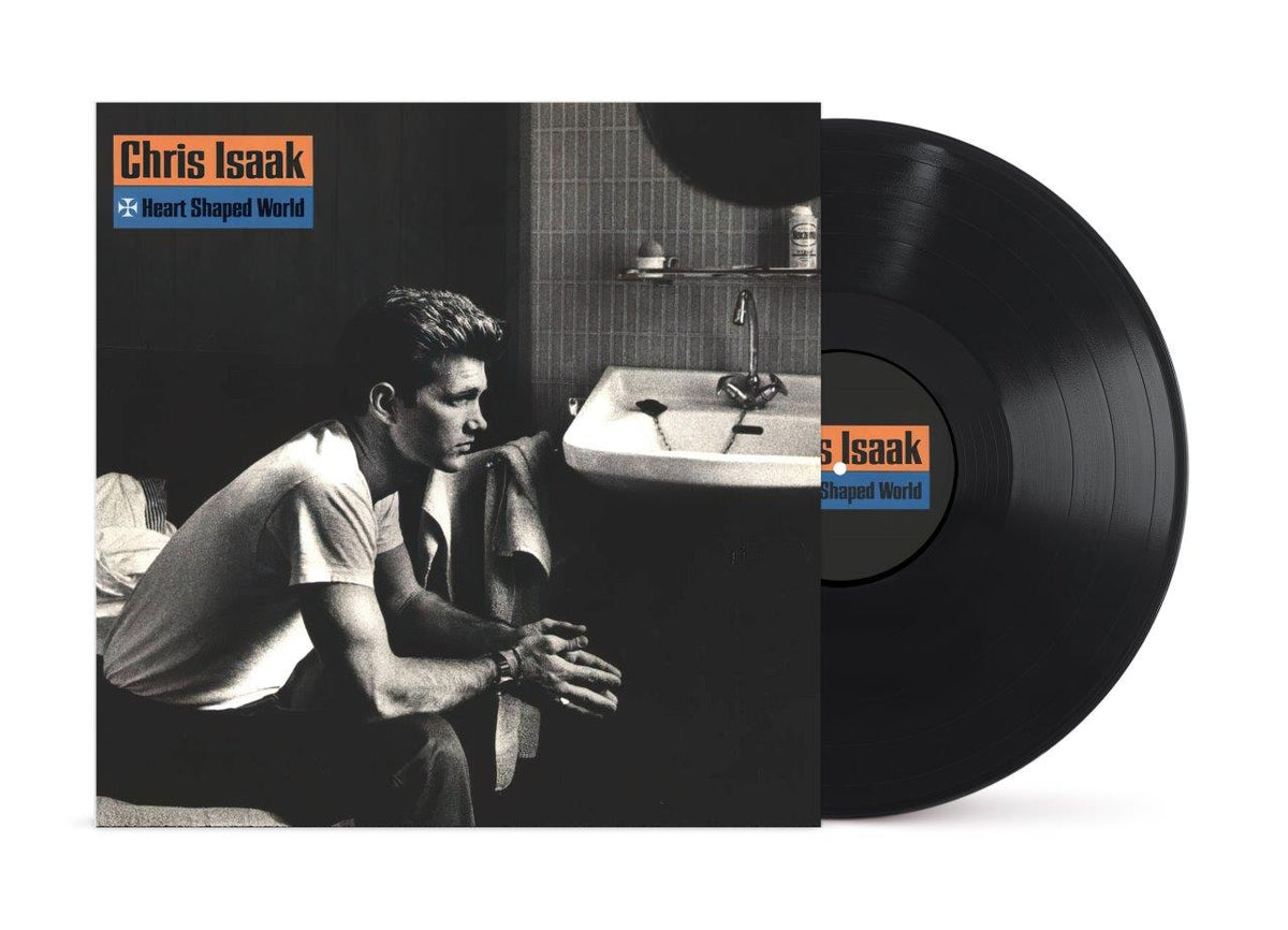 Chris Isaak’s “Heart Shaped World” vinyl record with album cover art.