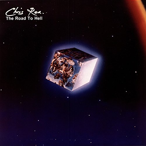 Chris Rea album cover: a floating, fractured cube in a starry sky.