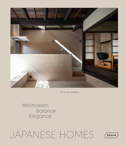 Interior view of a minimalist Japanese home with wooden beams and neutral tones.