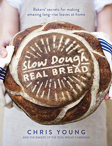 Book cover featuring a decorated loaf of bread held in hands.
