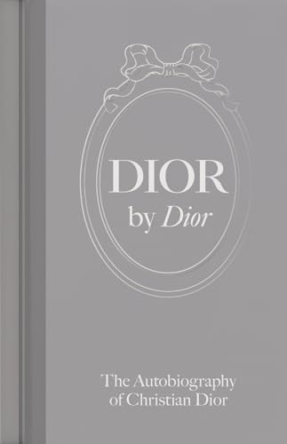 Gray book cover with “DIOR by Dior” and a decorative bow design.