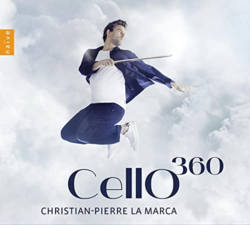 Cellist Christian-Pierre La Marca mid-air against a cloudy blue background.