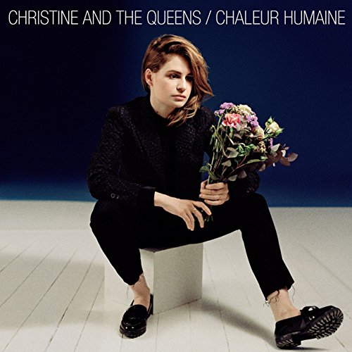 Christine and the Queens album cover featuring a person with flowers.