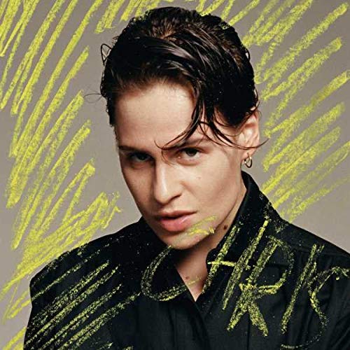 Close-up portrait of Chris by Christine and the Queens, with yellow markings.
