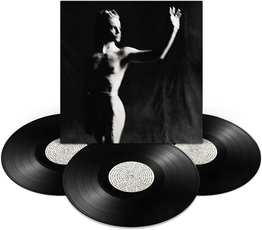 Triple vinyl record set with a black and white image of a figure.